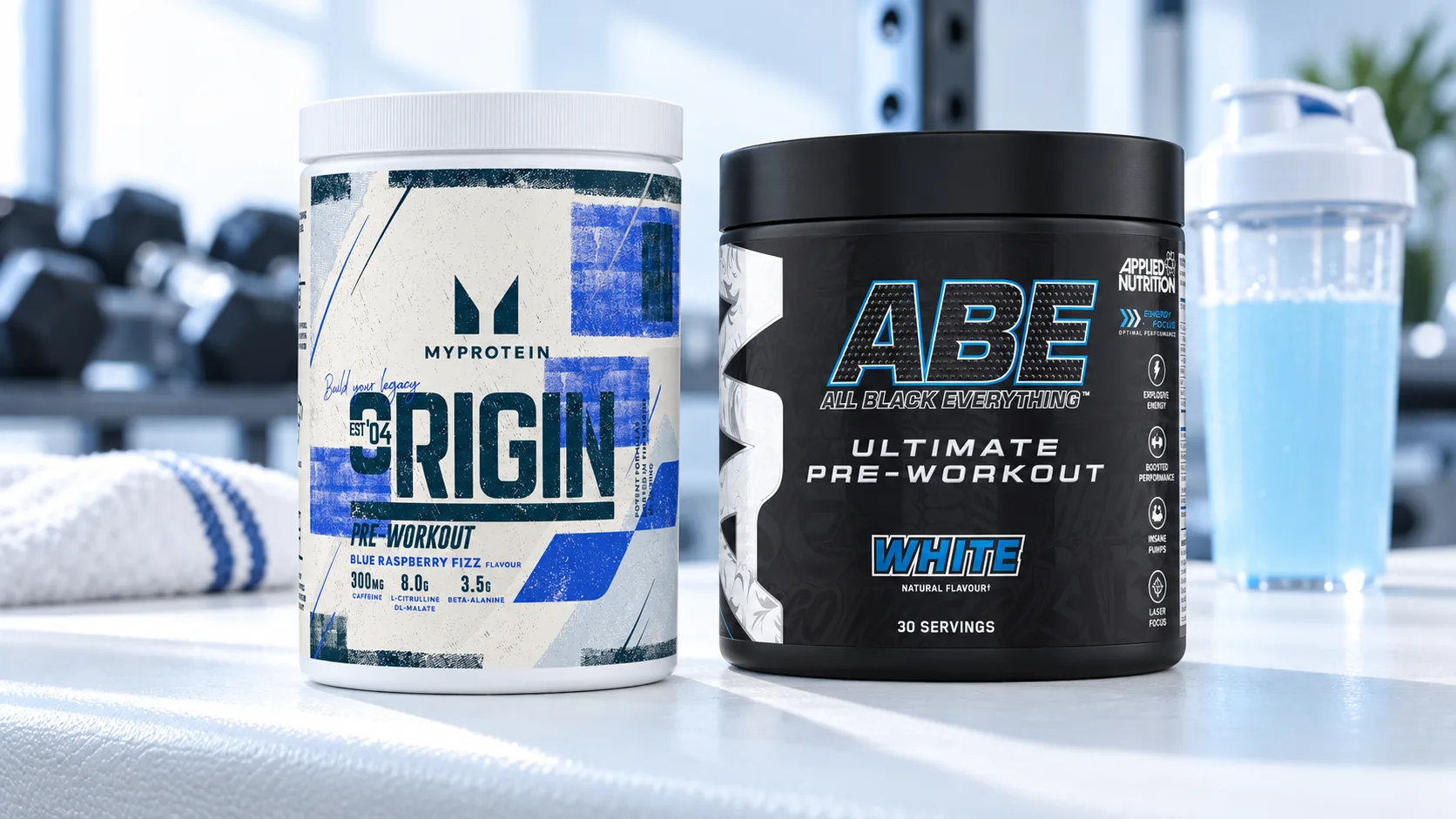A tub of Myprotein Origin Pre-Workout in Blue Raspberry Fizz next to a tub of Applied Nutrition ABE Ultimate Pre-Workout, with a shaker of blue pre-workout drink in a gym